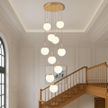 Nexa Chandelier Light | Cascading Glass Spheres with Gold Trim